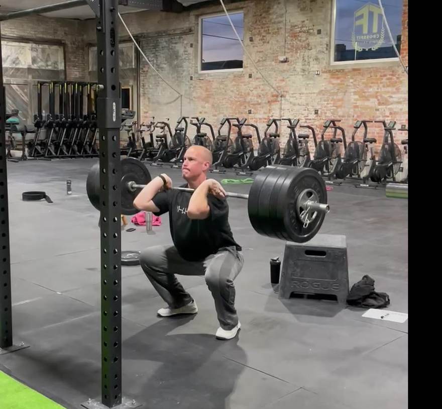 Dr. Alex White at depth in a front squat