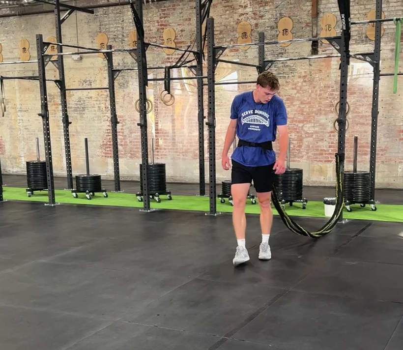 A young athlete standing ready for a conditioning drill