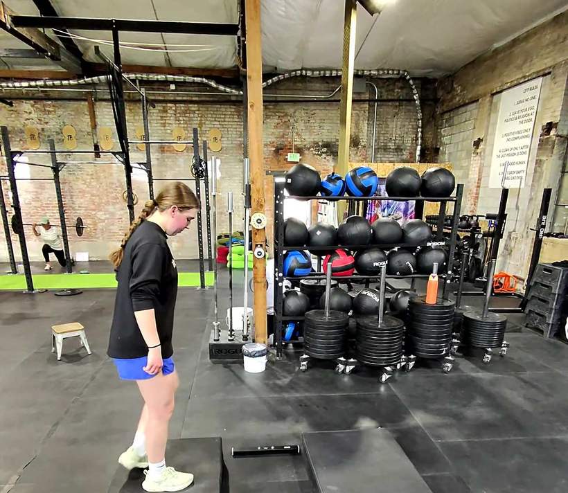 An athlete preparing for a box step-up