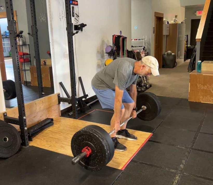 An athlete setting up for a deadlift